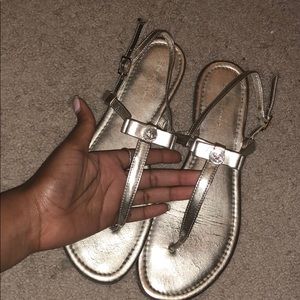 BCBGeneation gold sandals with a bow